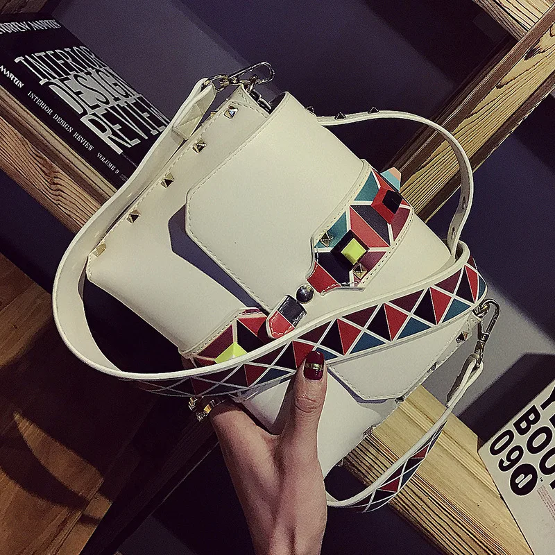 New Tide Hit Color Shoulder Bag Rivet Square Package Color Shoulder strap Fashion Handbag Tote
New Tide Hit Color Shoulder Bag Rivet Square Package Color Shoulder strap Fashion Handbag Tote