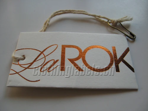 custom clothing tags, hang tags with string and safety pin, red color hot stamping, as custom design and logo
custom clothing tags, hang tags with string and safety pin, red color hot stamping, as custom design and logo