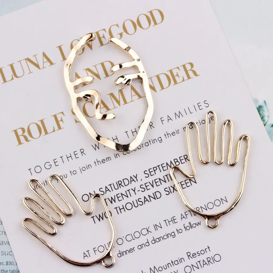 10Pcs Bright Gold Plating Punk Metal Pendant Brief Creative Hollow Face Hand Charms For DIY Necklace Earrings Jewelry Findings
10Pcs Bright Gold Plating Punk Metal Pendant Brief Creative Hollow Face Hand Charms For DIY Necklace Earrings Jewelry Findings