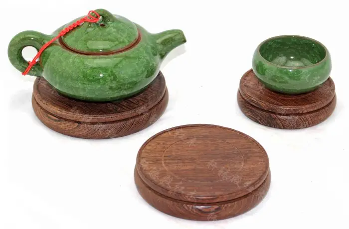Dark wenge wood base coaster round red teapot vase bonsai odd jade carvings agate ornaments
Dark wenge wood base coaster round red teapot vase bonsai odd jade carvings agate ornaments