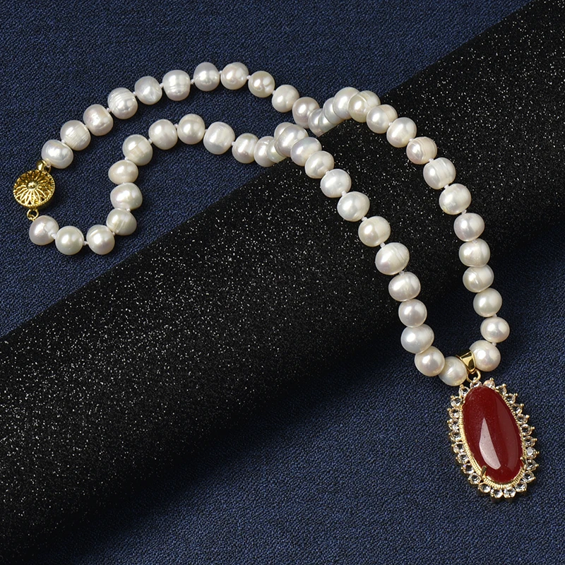 Having a saffron Oval 24*40*10 MM Pendant with golden edges and pure white pearls 8-9 MM Freshwater Natural Pearl Necklace
Having a saffron Oval 24*40*10 MM Pendant with golden edges and pure white pearls 8-9 MM Freshwater Natural Pearl Necklace