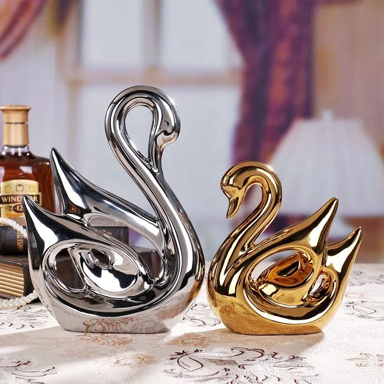 Nice Silver and Gold colour ceramic porcelain Swan for home or wedding decoration Made in Jingdezhen
Nice Silver and Gold colour ceramic porcelain Swan for home or wedding decoration Made in Jingdezhen