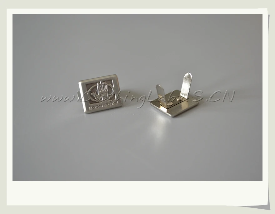 custom brand metal labels with embossed logo as custom design, flexible legs for hat, bag or clothing
custom brand metal labels with embossed logo as custom design, flexible legs for hat, bag or clothing
