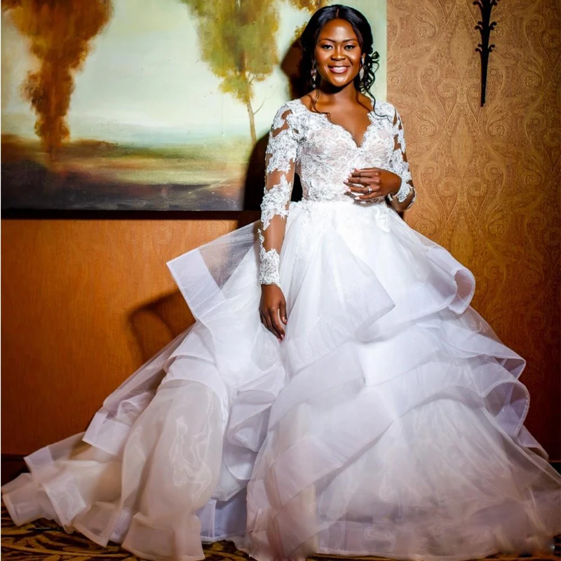 Newest 2021 Layer Skirt Ball Gown Wedding Dresses V Neck Long Sleeve Africa Wedding Dress Appliques Puffy Country Bridal Gowns
Newest 2021 Layer Skirt Ball Gown Wedding Dresses V Neck Long Sleeve Africa Wedding Dress Appliques Puffy Country Bridal Gowns