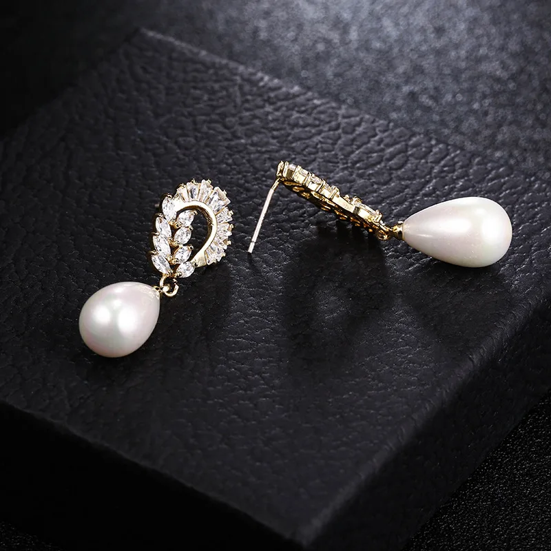 New Elanget Water Drop Imitation Pearl Gold Color Dangle Earring Austrian Crystal Drop Earring Jewelry for Women Party Gift
New Elanget Water Drop Imitation Pearl Gold Color Dangle Earring Austrian Crystal Drop Earring Jewelry for Women Party Gift