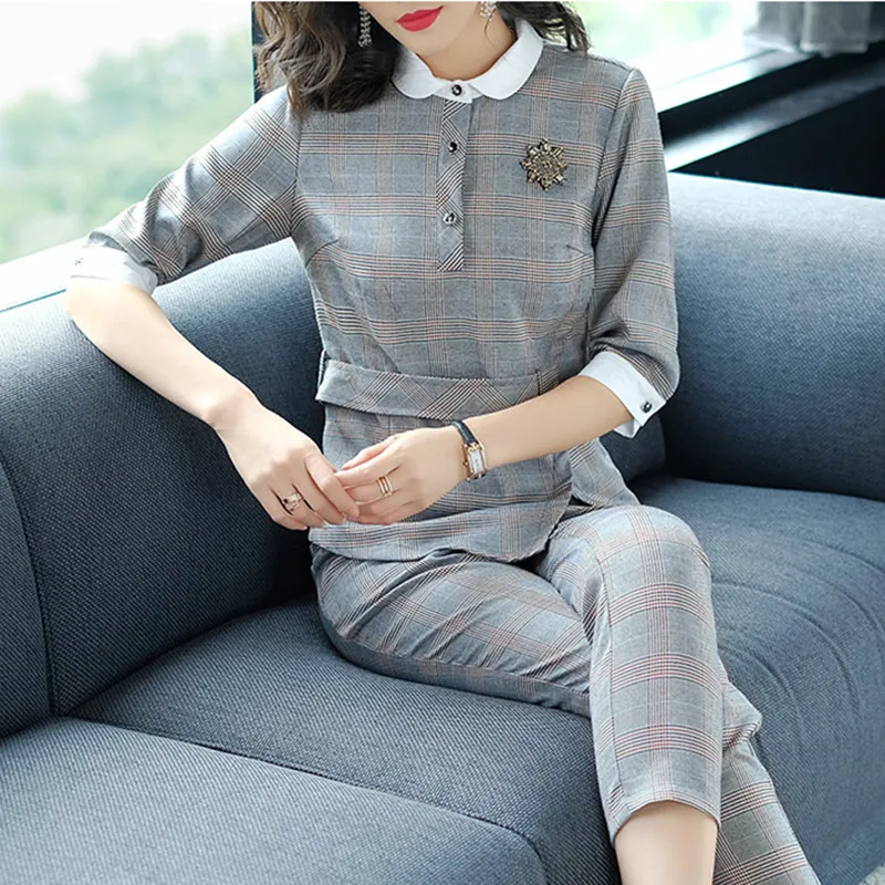 Women's spring and autumn new elegant doll collar irregular jacket + Slim straight pants pants fashion classic Plaid two sets
Women's spring and autumn new elegant doll collar irregular jacket + Slim straight pants pants fashion classic Plaid two sets