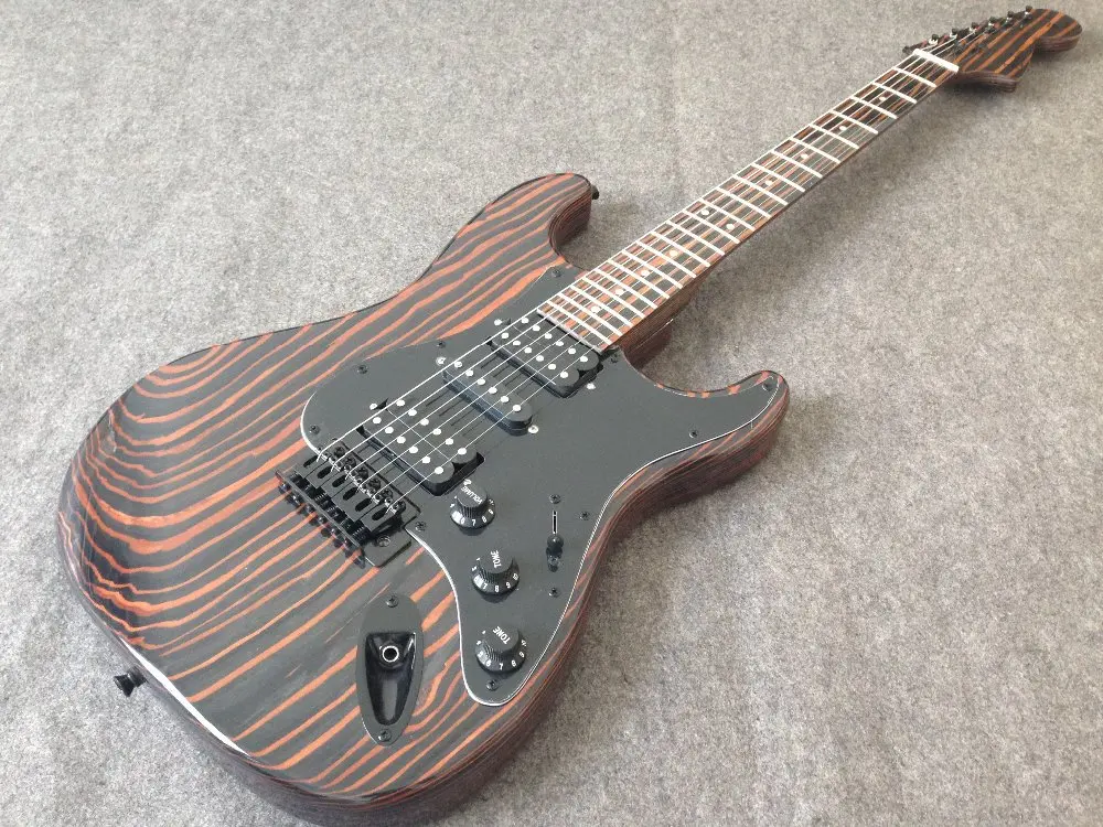 Solid Zebra wood body and neck electric guitar big headstock black hardware H-S-H pickups
Solid Zebra wood body and neck electric guitar big headstock black hardware H-S-H pickups