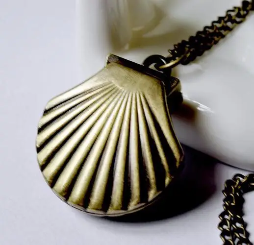New cartoon shell watch bronze necklace vintage jewelry wholesale Korean fashion sweater chain table wall charts
New cartoon shell watch bronze necklace vintage jewelry wholesale Korean fashion sweater chain table wall charts