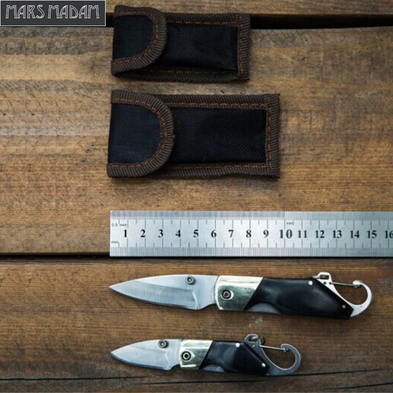 2pcs/pack Cutting tool outdoor folding knife key chain folding knife QQ portable saber brass+ebony handle
2pcs/pack Cutting tool outdoor folding knife key chain folding knife QQ portable saber brass+ebony handle