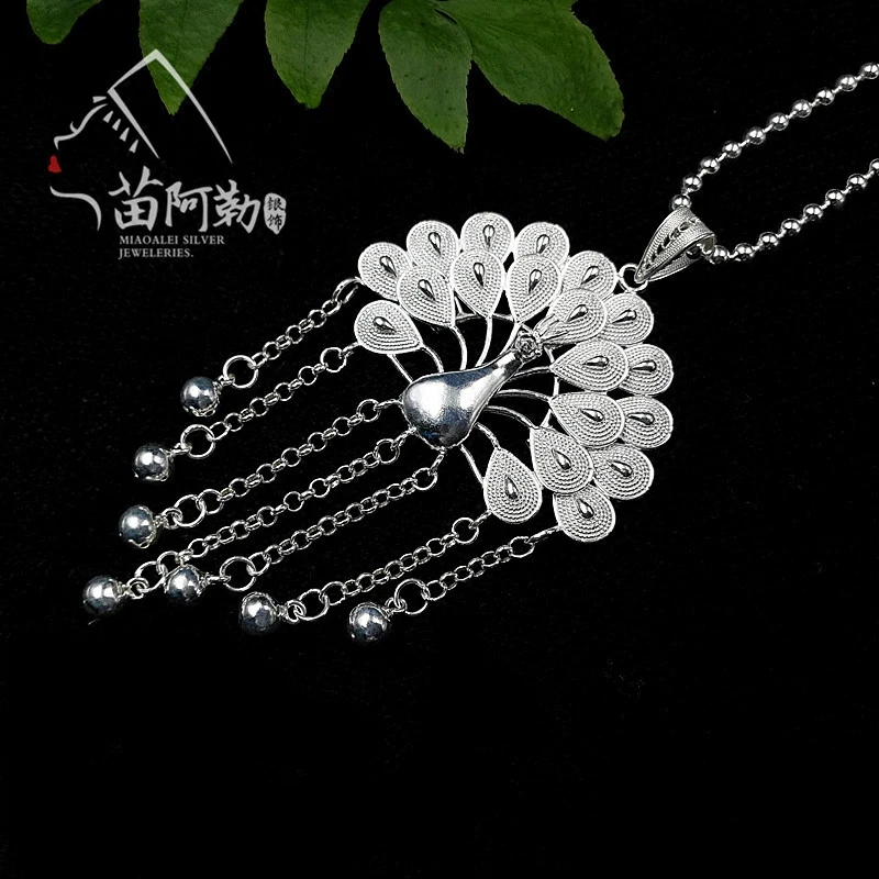Hand-brushed silk sterling silver tassel peacock pendant full silver sweater chain pendant Free shipping
Hand-brushed silk sterling silver tassel peacock pendant full silver sweater chain pendant Free shipping
