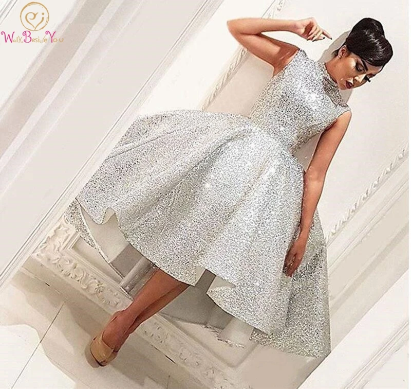 Silver Prom Dress High Front Low Back Sequined Custom Made Tea length Sleeveless High Neck Simple Sexy Elegant Evening Dress
Silver Prom Dress High Front Low Back Sequined Custom Made Tea length Sleeveless High Neck Simple Sexy Elegant Evening Dress