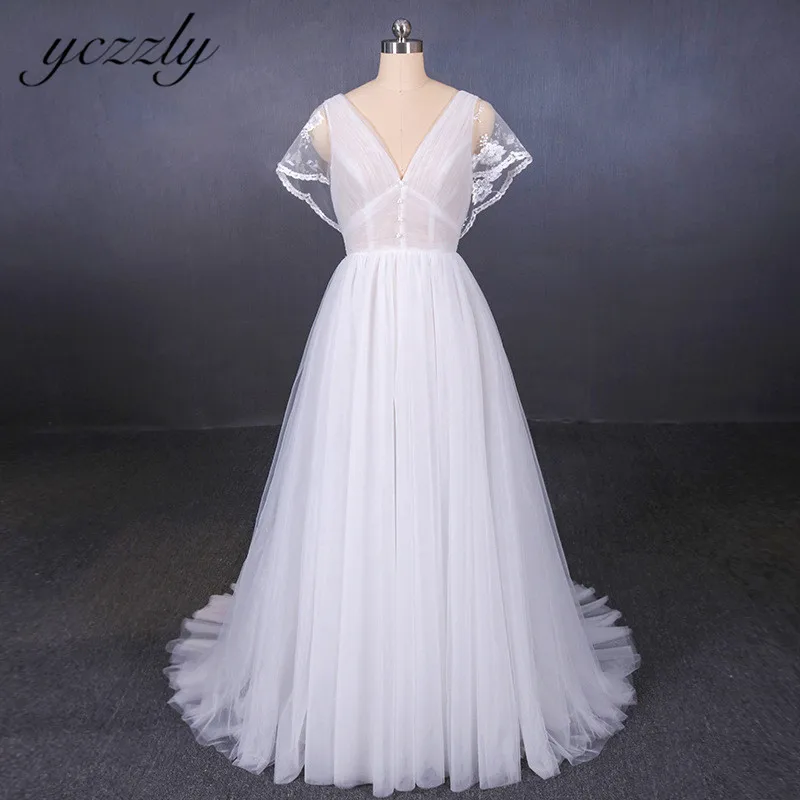 Yczzly Sexy Backless V-neck Lace Beach Wedding Dresses With Batwing Sleeves Long Tulle Bride Gown Ivory Vestido Noiva YW193
Yczzly Sexy Backless V-neck Lace Beach Wedding Dresses With Batwing Sleeves Long Tulle Bride Gown Ivory Vestido Noiva YW193
