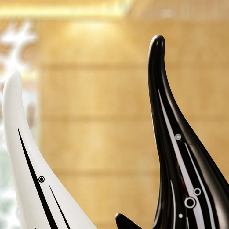 A black and white couple ceramic kissing fish modern home decoration of wedding gifts
A black and white couple ceramic kissing fish modern home decoration of wedding gifts