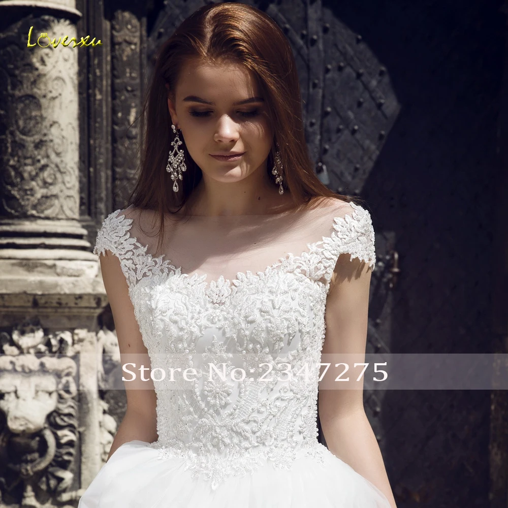 Loverxu Sexy Backless Scoop Neck Ball Gown Wedding Dresses 2019 Appliques Beaded Cap Sleeve Court Train Vintage Bridal Gowns 
Loverxu Sexy Backless Scoop Neck Ball Gown Wedding Dresses 2019 Appliques Beaded Cap Sleeve Court Train Vintage Bridal Gowns