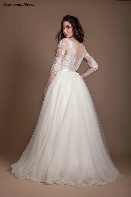Beach Wedding Dresses Boho 2019 Lace Appliques 3/4 Long Sleeves Floor Length Sheer Back Sashes Sexy Bridal Gowns Robe De Mariee
Beach Wedding Dresses Boho 2019 Lace Appliques 3/4 Long Sleeves Floor Length Sheer Back Sashes Sexy Bridal Gowns Robe De Mariee
