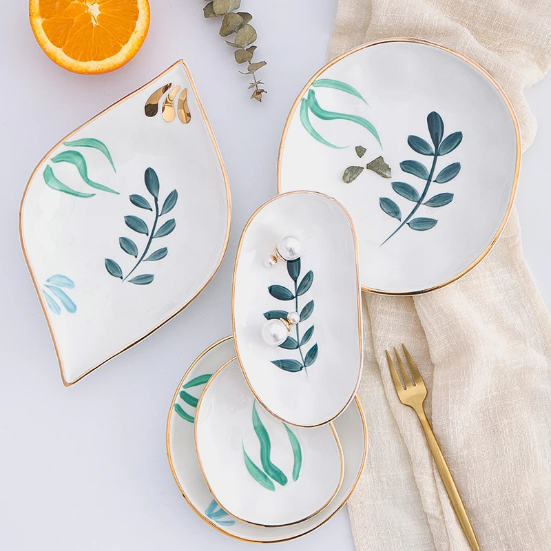 Nordic creative hand-painted gold-rimmed ceramic dish decorative dish snack plate jewelry storage tray decoration dessert dish
Nordic creative hand-painted gold-rimmed ceramic dish decorative dish snack plate jewelry storage tray decoration dessert dish
