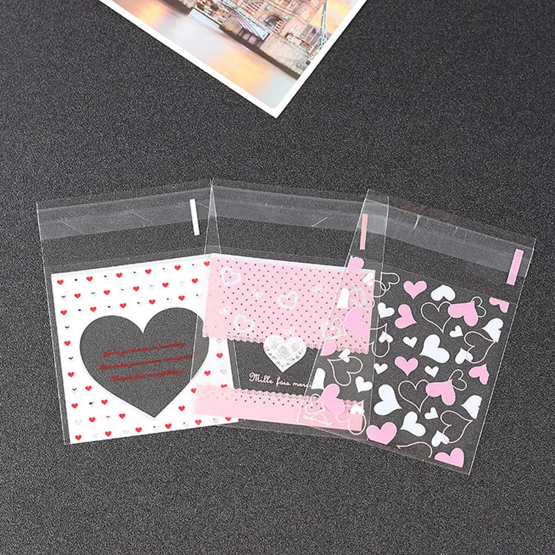 100pcs/lot Heart Pattern Cookie Packaging Bags Wedding Candy Bag Small Gift Bag Self Adhesive Plastic Bags 7x7cm
100pcs/lot Heart Pattern Cookie Packaging Bags Wedding Candy Bag Small Gift Bag Self Adhesive Plastic Bags 7x7cm
