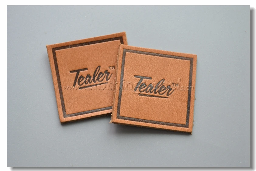 Custom genuine leather labels for clothing, light brown background with engraved logo
Custom genuine leather labels for clothing, light brown background with engraved logo