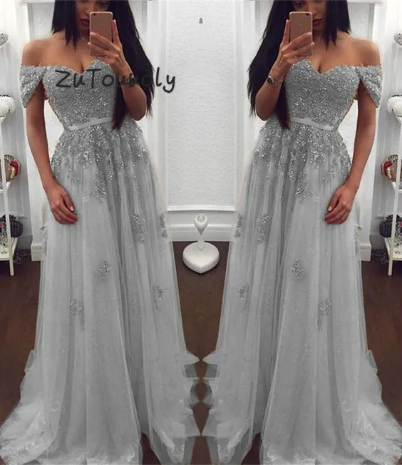 Silver Prom Dresses Off The Shoulder robe de soiree Dubai Arabic Evening Gowns Sexy Long Graduation Dress With Appliques Beaded
Silver Prom Dresses Off The Shoulder robe de soiree Dubai Arabic Evening Gowns Sexy Long Graduation Dress With Appliques Beaded