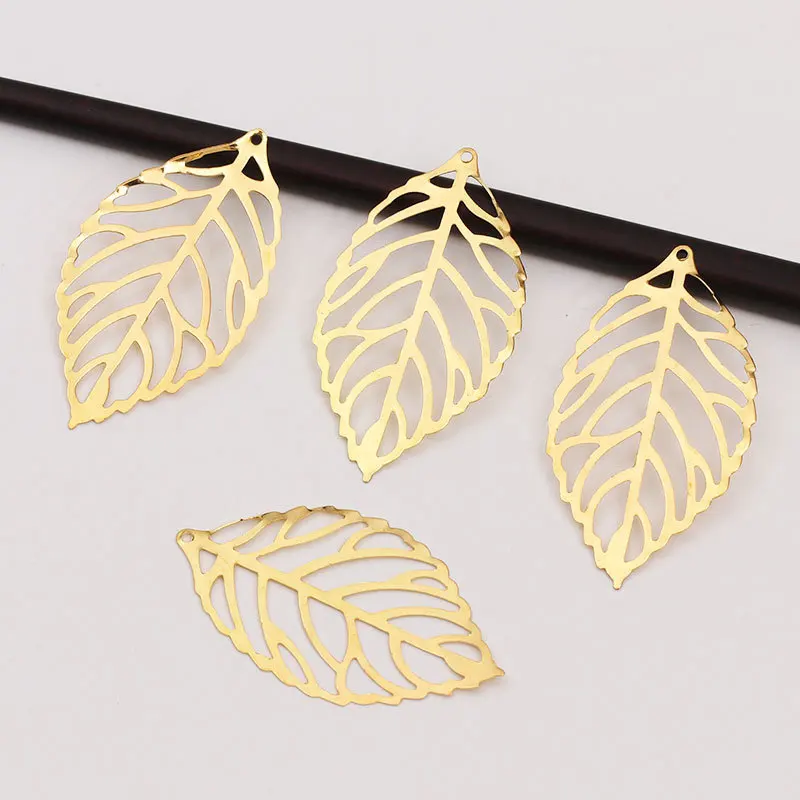 50pcs Craft Hollow Leaves Pendant Jewelry Accessories Gold Charm Filigree Jewelry Making Plated Vintage for Hair Comb Hot New
50pcs Craft Hollow Leaves Pendant Jewelry Accessories Gold Charm Filigree Jewelry Making Plated Vintage for Hair Comb Hot New