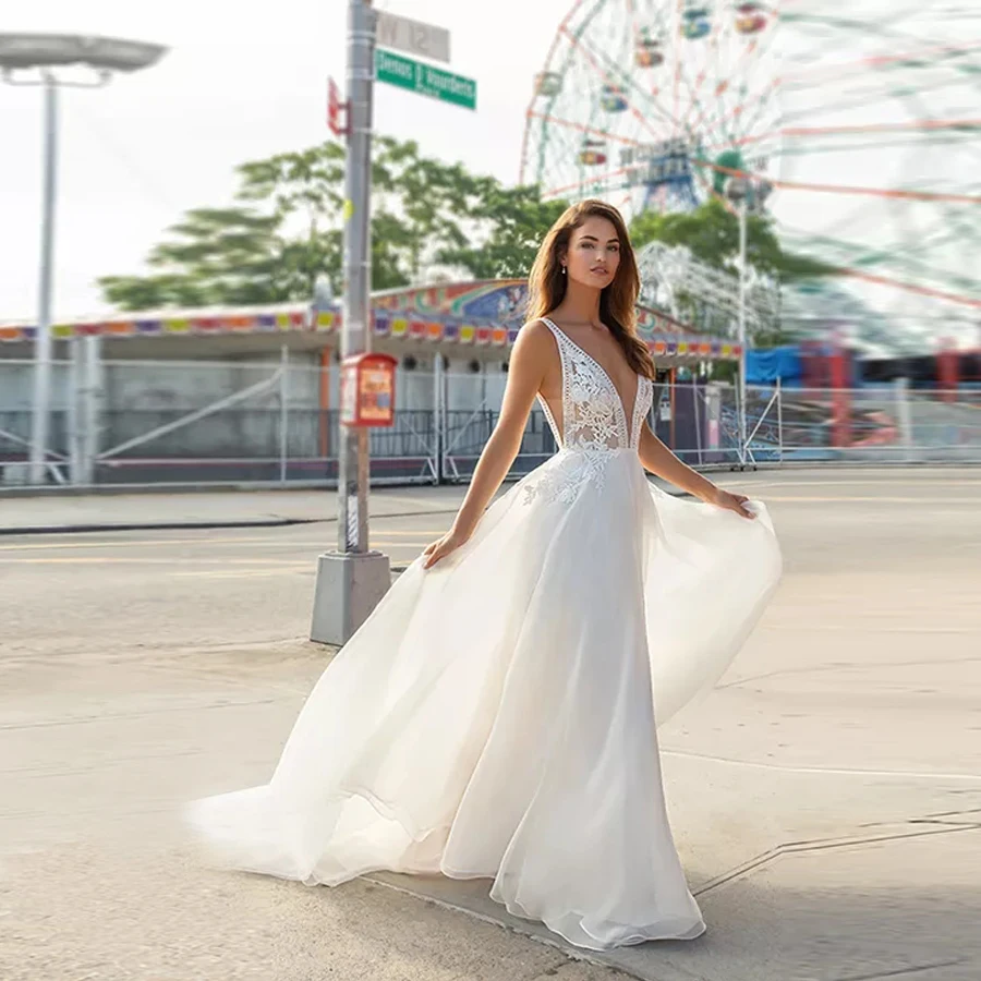 Ivory Organza a-Line Bridal Gown Plunging v-Neckline Edged With Embroidered Lace Bodice With Nude Underlay Wedding Dress
Ivory Organza a-Line Bridal Gown Plunging v-Neckline Edged With Embroidered Lace Bodice With Nude Underlay Wedding Dress