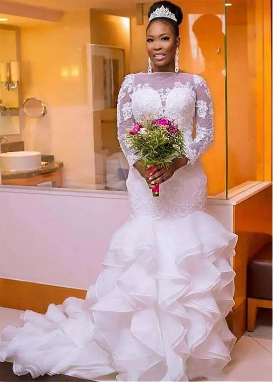Vintage African Mermaid Wedding Dresses With Organza Ruffles Sheer Long Sleeves Appliques Nigerian Plus Size Bridal Gowns 2019
Vintage African Mermaid Wedding Dresses With Organza Ruffles Sheer Long Sleeves Appliques Nigerian Plus Size Bridal Gowns 2019