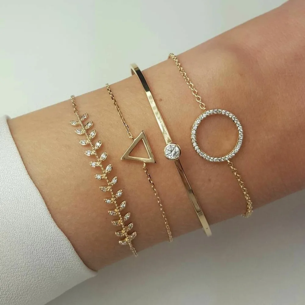 pack of 4 inspired bangle bracelet with metal leaves /triangle and rhinestone design in mixed link chains in gold tone
pack of 4 inspired bangle bracelet with metal leaves /triangle and rhinestone design in mixed link chains in gold tone