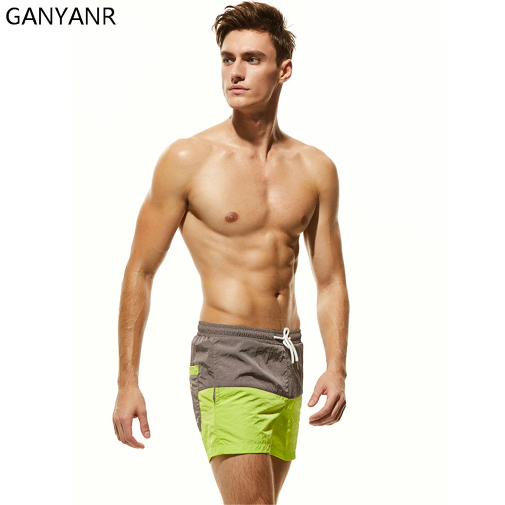 GANYANR Mens Swimming Shorts Swimwear Bermuda Surf Wear Boardshorts Beach quick dry Swimsuit Swim Boxer Sexy Sea Bathing Suit
GANYANR Mens Swimming Shorts Swimwear Bermuda Surf Wear Boardshorts Beach quick dry Swimsuit Swim Boxer Sexy Sea Bathing Suit