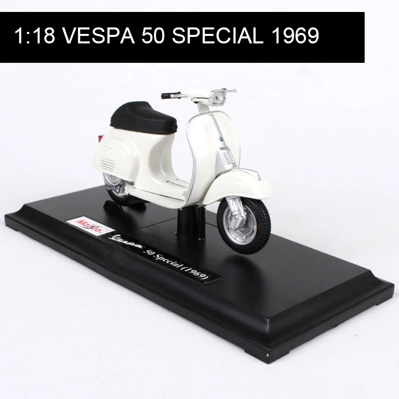 Модель мотоцикла Maisto 1:18 VESPA Piaggio 50, специальная модель 1969, база для велосипеда, литые мото, детская игрушка для подарочной коллекции
Модель мотоцикла Maisto 1:18 VESPA Piaggio 50, специальная модель 1969, база для велосипеда, литые мото, детская игрушка для подарочной коллекции