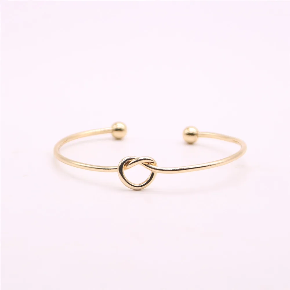 Fashion lovely knotted bangles iron alloy electroplated gold bangle for women wholesale
Fashion lovely knotted bangles iron alloy electroplated gold bangle for women wholesale
