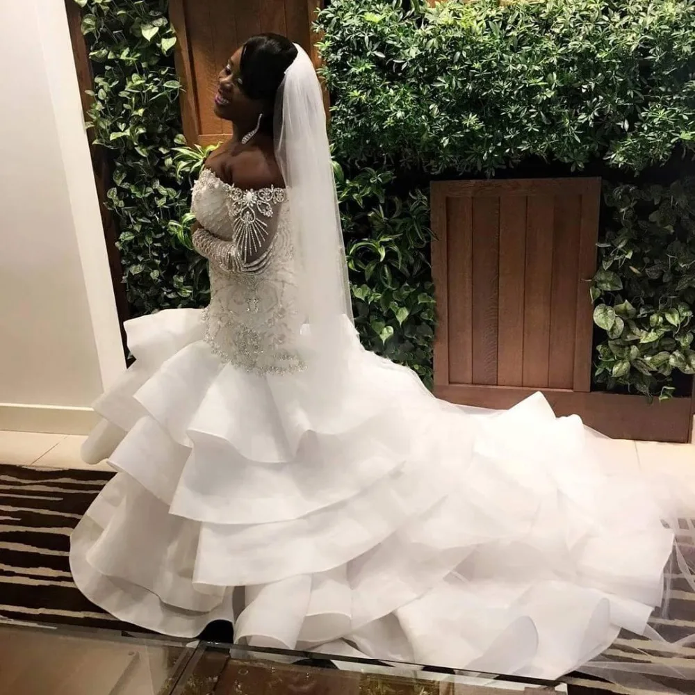 2018 Sexy Plus Size Mermaid Wedding Gowns Sweetheart Off Shoulder Long Sleeves Beading African Bride Dress Ruffles Chapel Train
2018 Sexy Plus Size Mermaid Wedding Gowns Sweetheart Off Shoulder Long Sleeves Beading African Bride Dress Ruffles Chapel Train