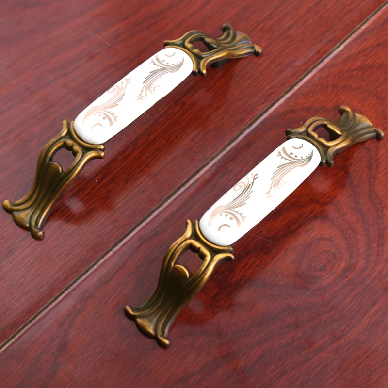 96mm 128mm antique bronze dresser door handles golden flower cream ceramic kitchen cabinet drawer cupboard pulls handles knobs 5
96mm 128mm antique bronze dresser door handles golden flower cream ceramic kitchen cabinet drawer cupboard pulls handles knobs 5