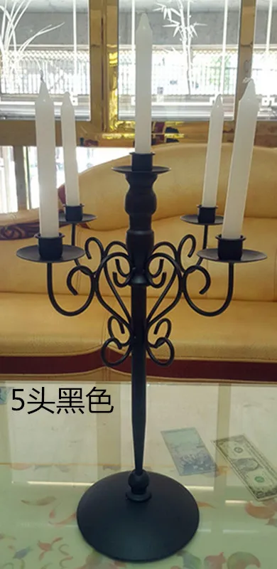 Continental Retro Black five head three head table iron candlestick romantic wedding wedding supplies.
Continental Retro Black five head three head table iron candlestick romantic wedding wedding supplies.
