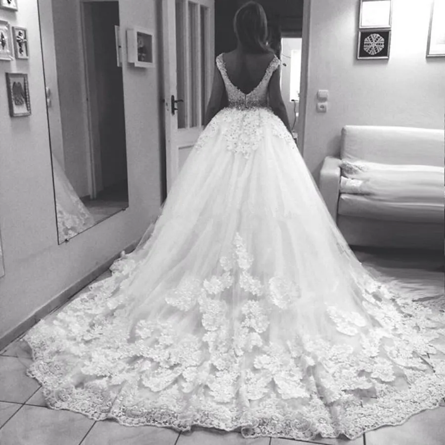 Vestido de noiva princesa Luxury Wedding Dress Cap Sleeve V-Neck Lace Applique Low Back Crystal Belt wedding gown robe de mariee
Vestido de noiva princesa Luxury Wedding Dress Cap Sleeve V-Neck Lace Applique Low Back Crystal Belt wedding gown robe de mariee