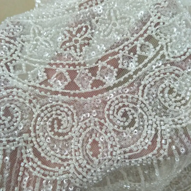 Heavy beading lace fabric with sequins elegent ivory sparkle wedding dress fabric worlwide shipping sell by yard
Heavy beading lace fabric with sequins elegent ivory sparkle wedding dress fabric worlwide shipping sell by yard