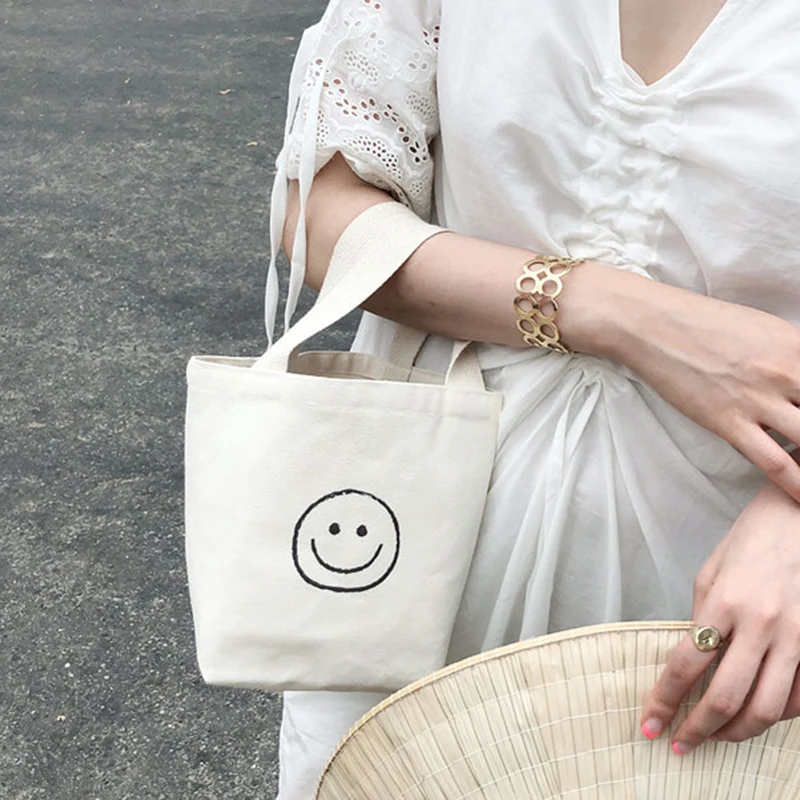 Mini Canvas Tote Bag Women Small Cute Smile Printing Top-handle Bag 2021 Female Korean Fashion Fabric Cellphone Wristlets Purse
Mini Canvas Tote Bag Women Small Cute Smile Printing Top-handle Bag 2021 Female Korean Fashion Fabric Cellphone Wristlets Purse