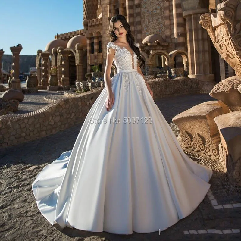 Satin Wedding Dresses Ball Gown Cap Sleeves Deep V Neck 3D Flowers Button Illusion Court Train Vestido De Noiva Bridal Gowns
Satin Wedding Dresses Ball Gown Cap Sleeves Deep V Neck 3D Flowers Button Illusion Court Train Vestido De Noiva Bridal Gowns