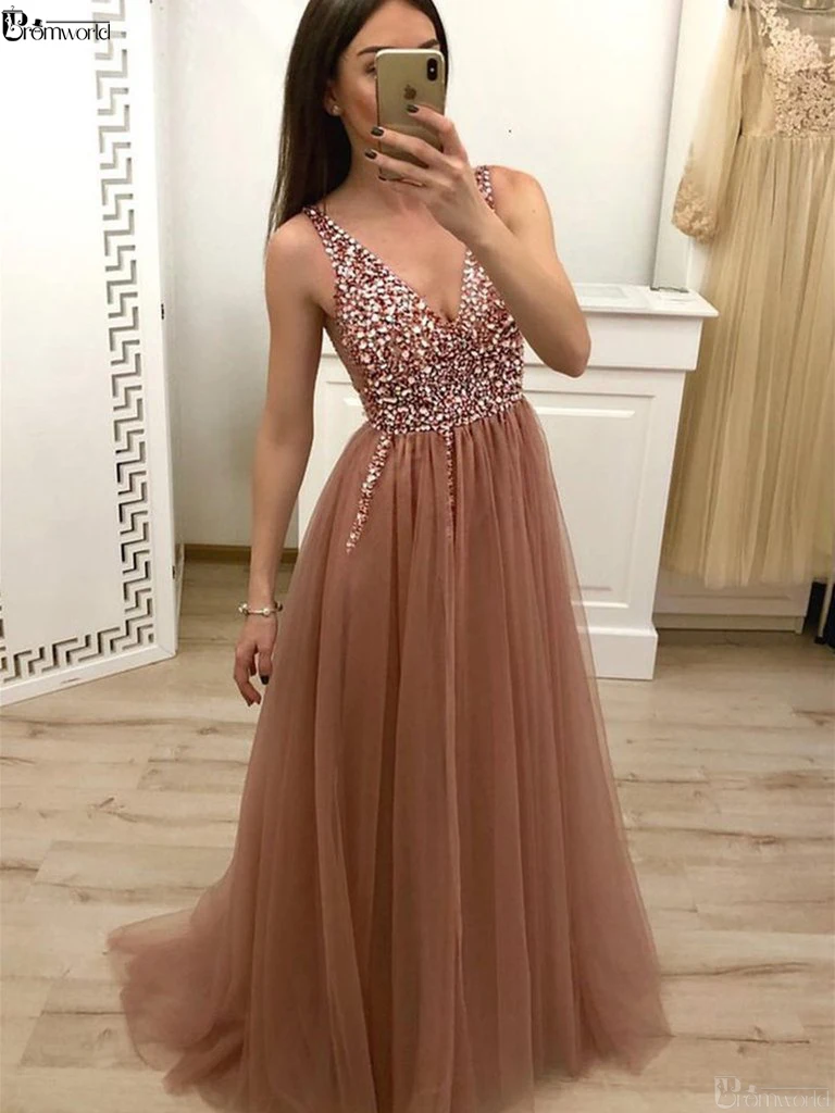 Champagne Prom Dress Long Evening Gowns A Line V Neck Cross Back Sequins Beaded Tulle Sexy Evening Dresses robe soiree dubai
Champagne Prom Dress Long Evening Gowns A Line V Neck Cross Back Sequins Beaded Tulle Sexy Evening Dresses robe soiree dubai