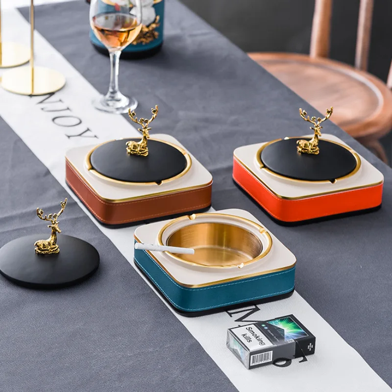 Light luxury modern ashtray personality household living room coffee table anti flying ashtray with cover American gift
Light luxury modern ashtray personality household living room coffee table anti flying ashtray with cover American gift