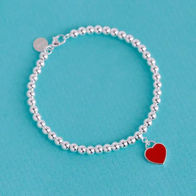 11 S925 sterling silver ladies classic enamel heart-shaped tag 4m bead bracelet European American popular ladies holiday gifts
11 S925 sterling silver ladies classic enamel heart-shaped tag 4m bead bracelet European American popular ladies holiday gifts