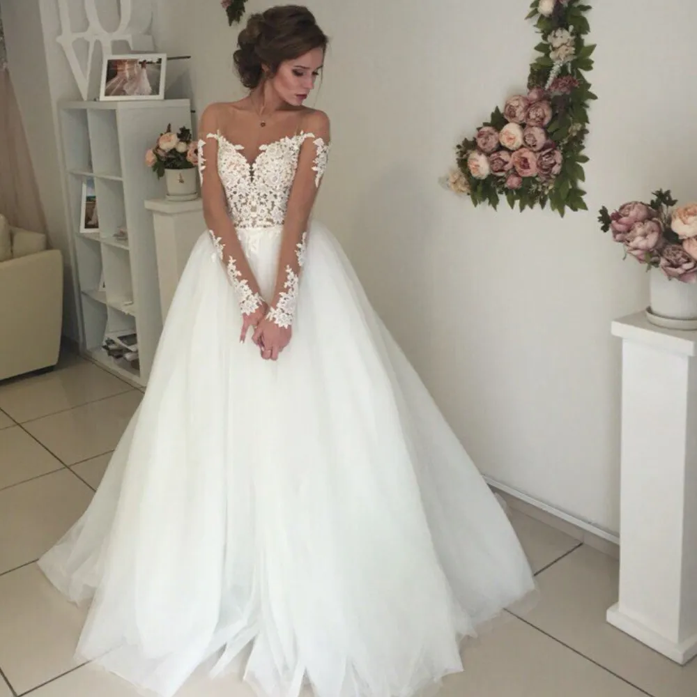 Newest Long Sleeves Women Wedding Gowns Scoop Ball Gown Applliques Tulle Sweep Train Bridal Dresses Sexy Backless Design
Newest Long Sleeves Women Wedding Gowns Scoop Ball Gown Applliques Tulle Sweep Train Bridal Dresses Sexy Backless Design