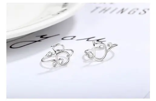S925 sterling silver ring vibrato sweet hollow short ring temperament letter simple opening female ring Party Decoration
S925 sterling silver ring vibrato sweet hollow short ring temperament letter simple opening female ring Party Decoration