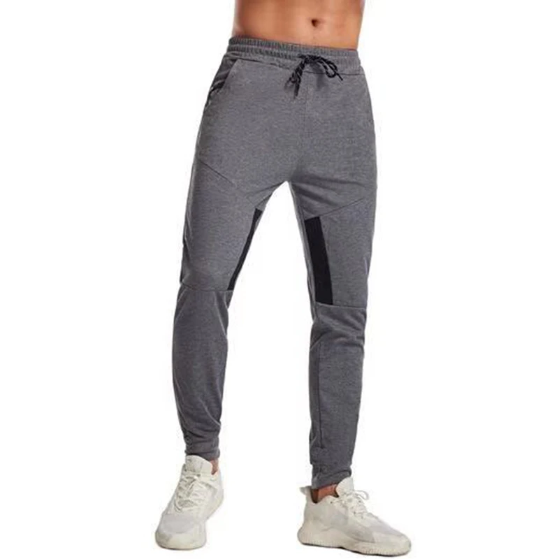 European and American men's fitness sports leisure trousers men's stitching tight jogging solid color casual pants wholesale
European and American men's fitness sports leisure trousers men's stitching tight jogging solid color casual pants wholesale