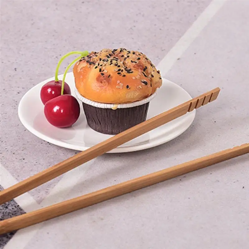 1 Pcs Kitchen Food Tongs Heat-Proof Bread Cake Dessert Clamp Natural Wooden Non-Slip Vegetable Fruits Clips Kitchen Tools
1 Pcs Kitchen Food Tongs Heat-Proof Bread Cake Dessert Clamp Natural Wooden Non-Slip Vegetable Fruits Clips Kitchen Tools