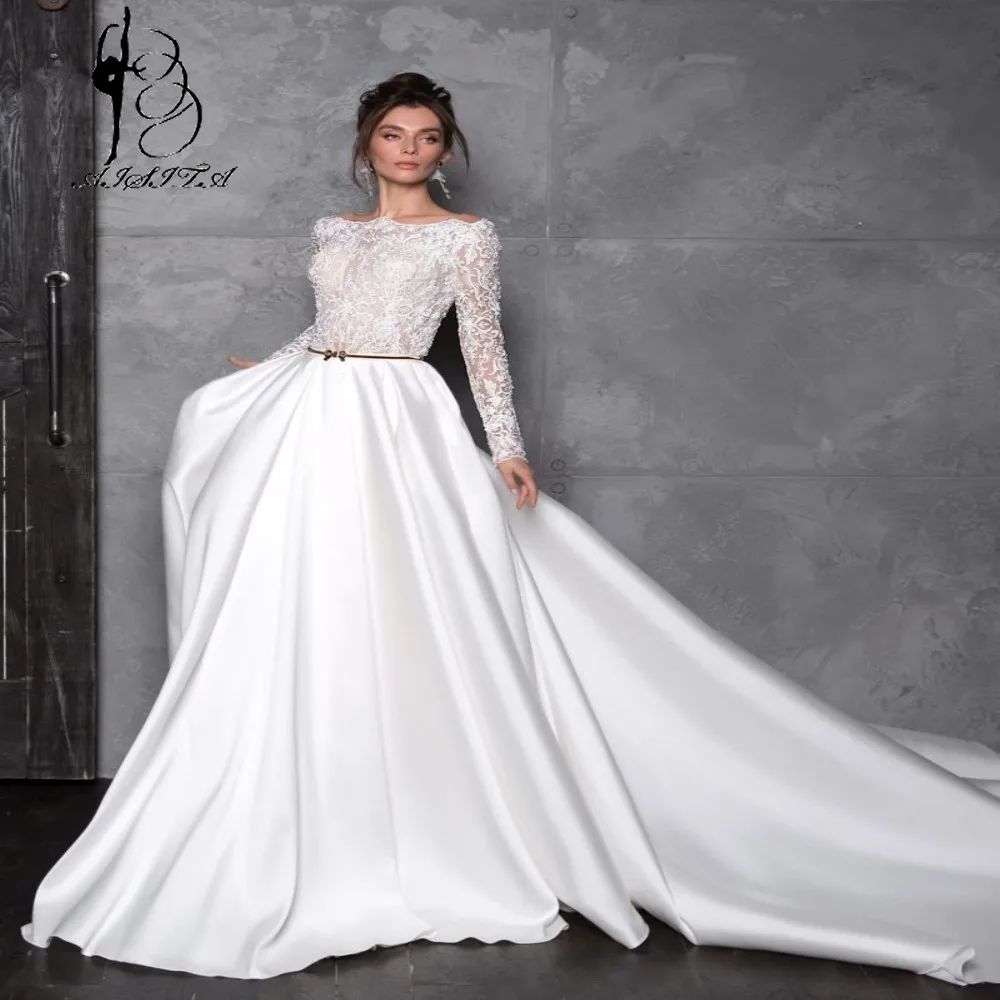 Кружевное атласное свадебное платье с вырезом лодочкой и длинным рукавом
Кружевное атласное свадебное платье с вырезом лодочкой и длинным рукавом