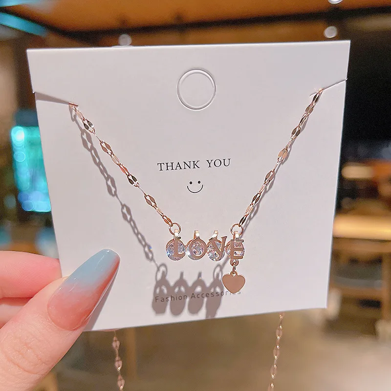 Trendy Fashion Personality Zircon LOVE Pendant Titanium Steel Necklace Female Niche Design Sense Exquisite Clavicle Chain
Trendy Fashion Personality Zircon LOVE Pendant Titanium Steel Necklace Female Niche Design Sense Exquisite Clavicle Chain