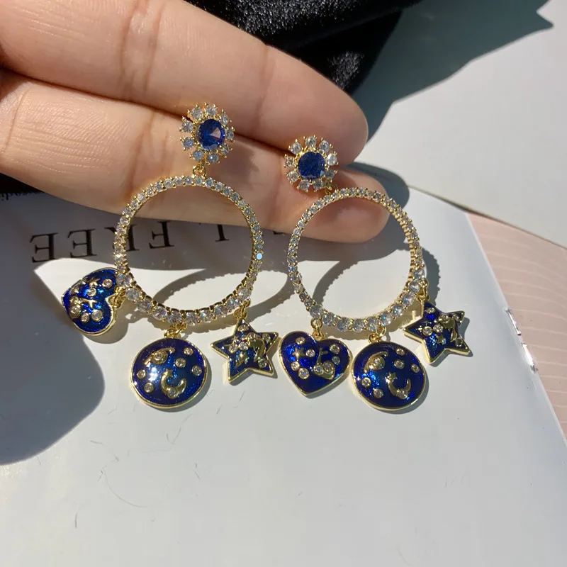 big cz circle with blue heart and star charm drop fashion earrings for women
big cz circle with blue heart and star charm drop fashion earrings for women