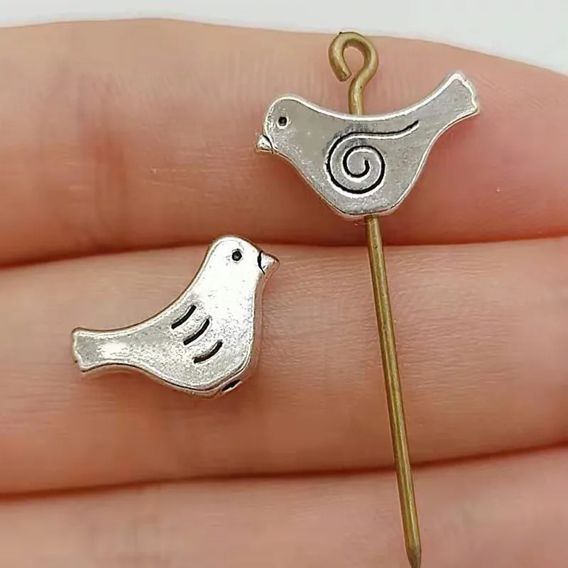 20pcs15x9mm Spacer Beads Charms Bird Silver Color Pendants Antique Jewelry Making DIY Handmade Craft
20pcs15x9mm Spacer Beads Charms Bird Silver Color Pendants Antique Jewelry Making DIY Handmade Craft