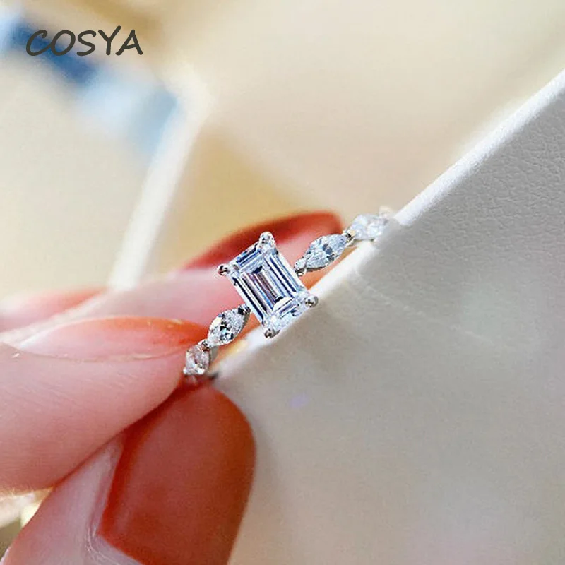 COSYA сверкающих для женщин 100% 925 стерлингового серебра прямоугольник высокоуглеродистой Diamond Классический Обручальные кольца, хорошее ювели...
COSYA сверкающих для женщин 100% 925 стерлингового серебра прямоугольник высокоуглеродистой Diamond Классический Обручальные кольца, хорошее ювели...