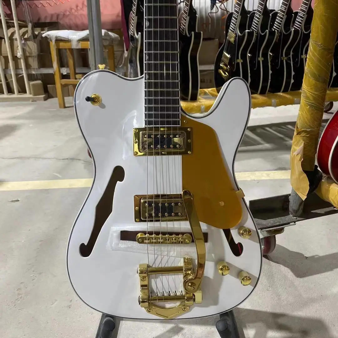 Tele электрическая гитара Золотая фурнитура с Bigsby F полый корпус палисандр фингерборд Бесплатная доставка
Tele электрическая гитара Золотая фурнитура с Bigsby F полый корпус палисандр фингерборд Бесплатная доставка